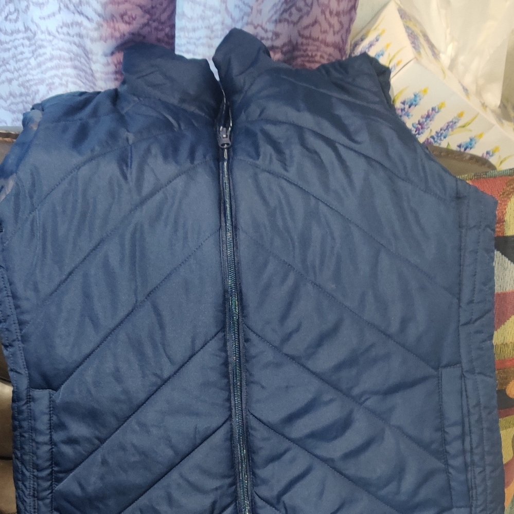 Vest, blue color puffy, size large for women